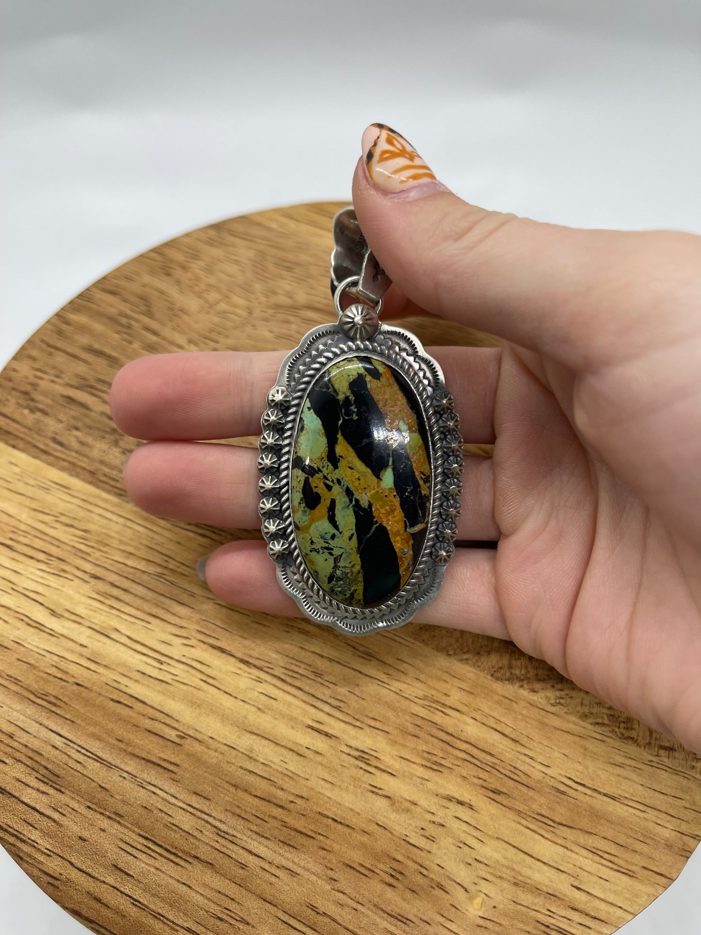 Black Jack Turquoise Oval Pendant with a 11.5mm Bale by Gilbert Platero, Navajo