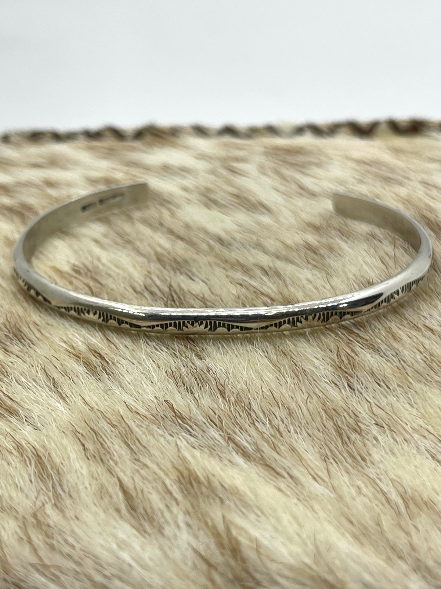5.75" - 7.25" Stamped Stacker Band by Elaine Tahe, Navajo