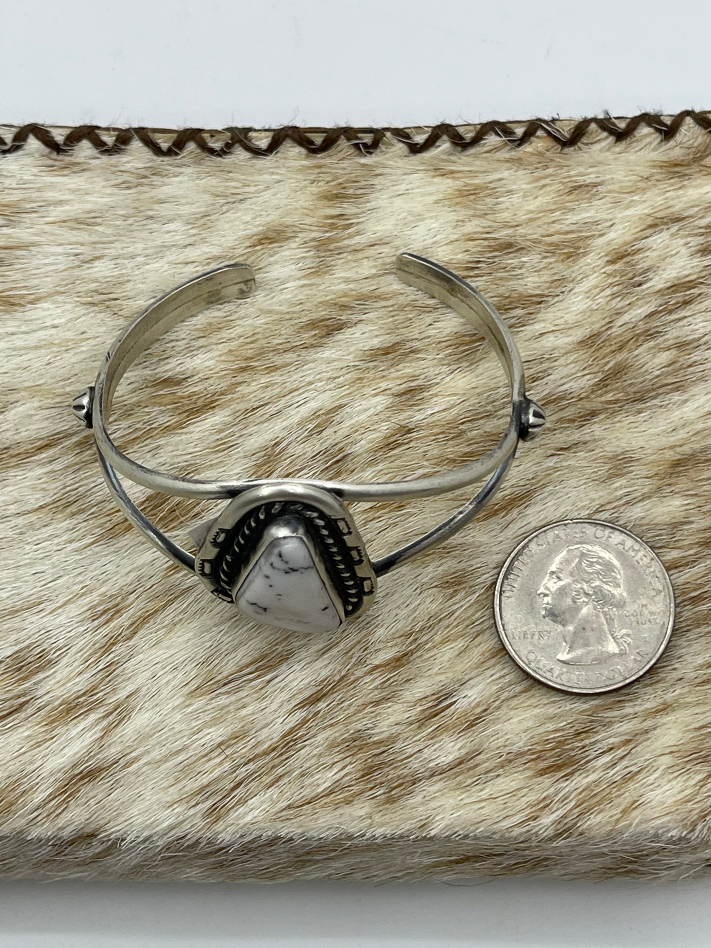 5 1/2"-7 1/2" White Buffalo Triangle Cuff by Johnny Dixon, Navajo