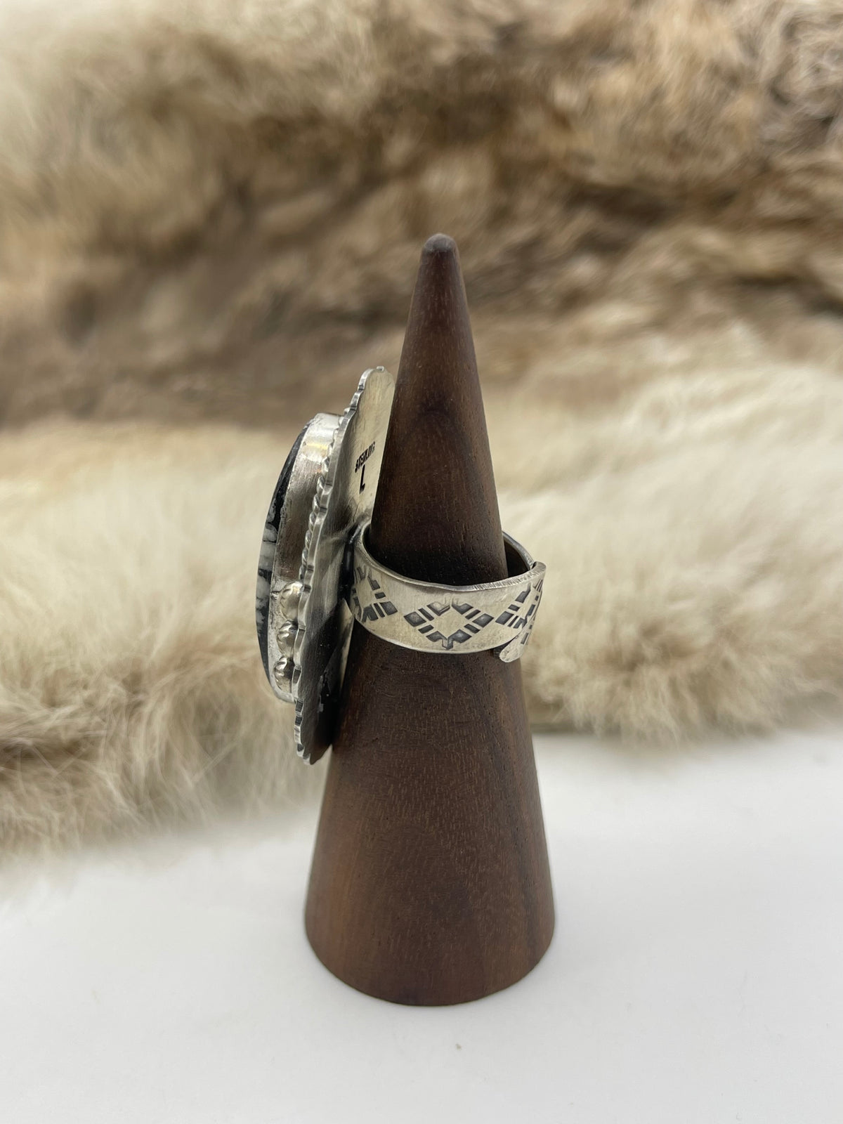 LOT 24 C 9/6 Adjustable 7.0-10.0 White Buffalo Ring with Stamped "L" by Artist