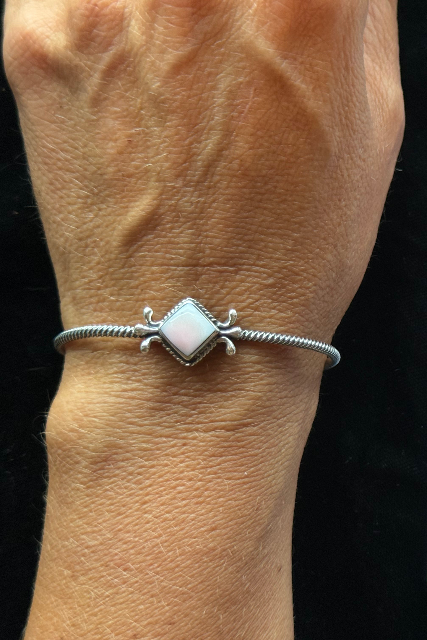 Pink Conch Twisted Wire Cuff by Mike Smith, Navajo