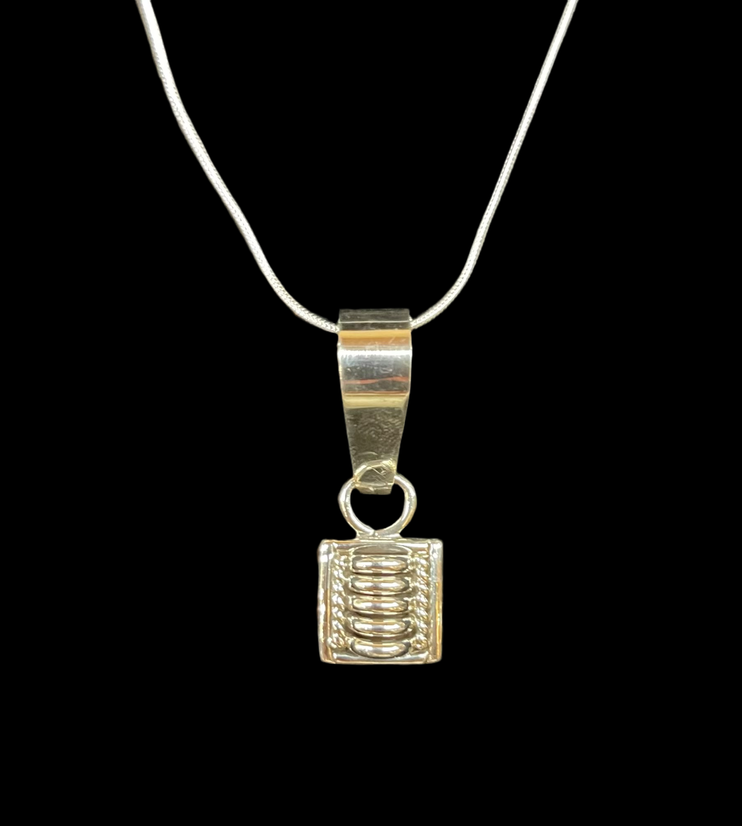 Sterling Silver Pendant by Thomas Charley, Navajo