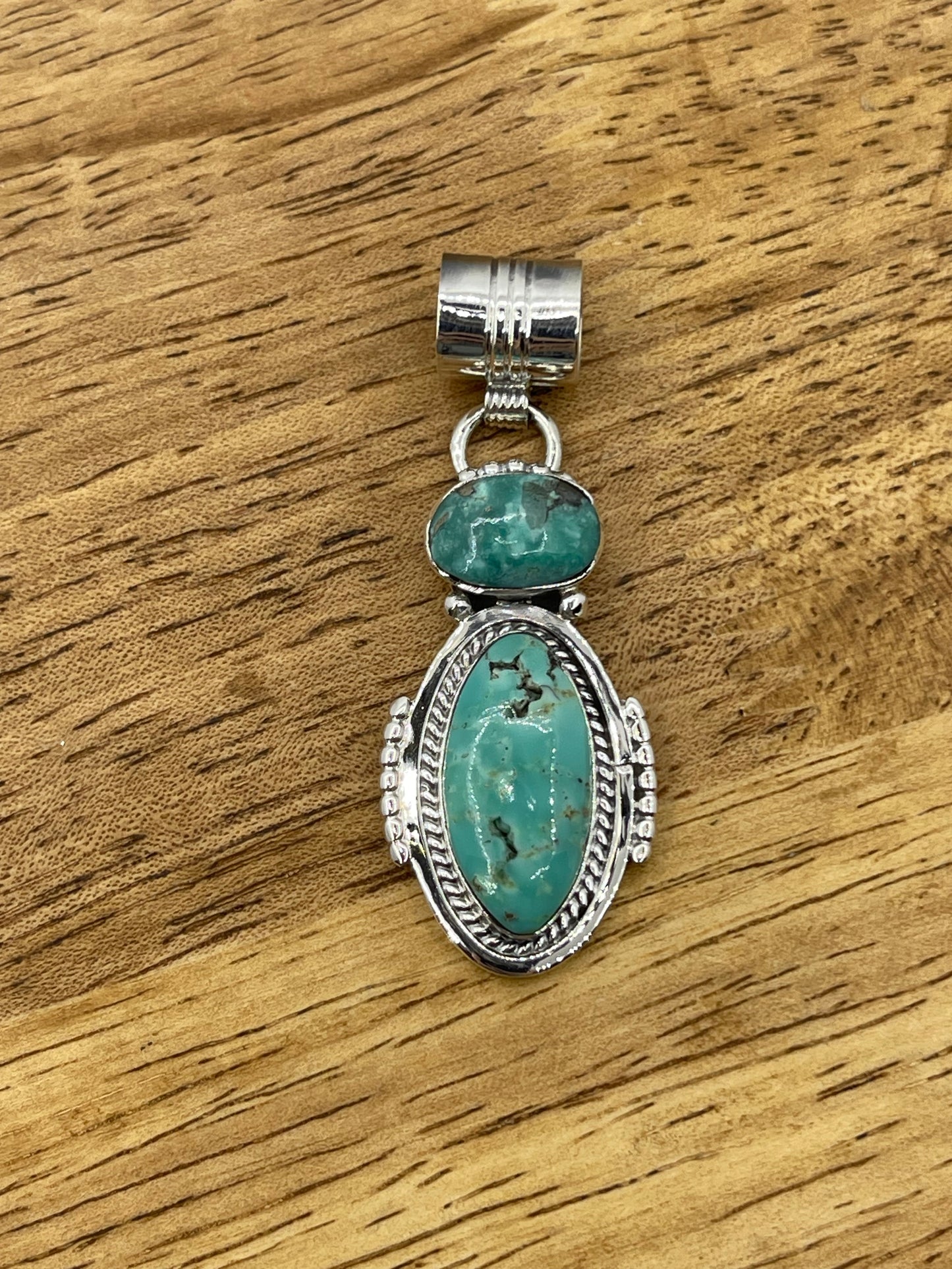 2 Stone Turquoise Oval Pendant with a 7.4mm Bale by Sadie Jim, Navajo (Matrix Varies)