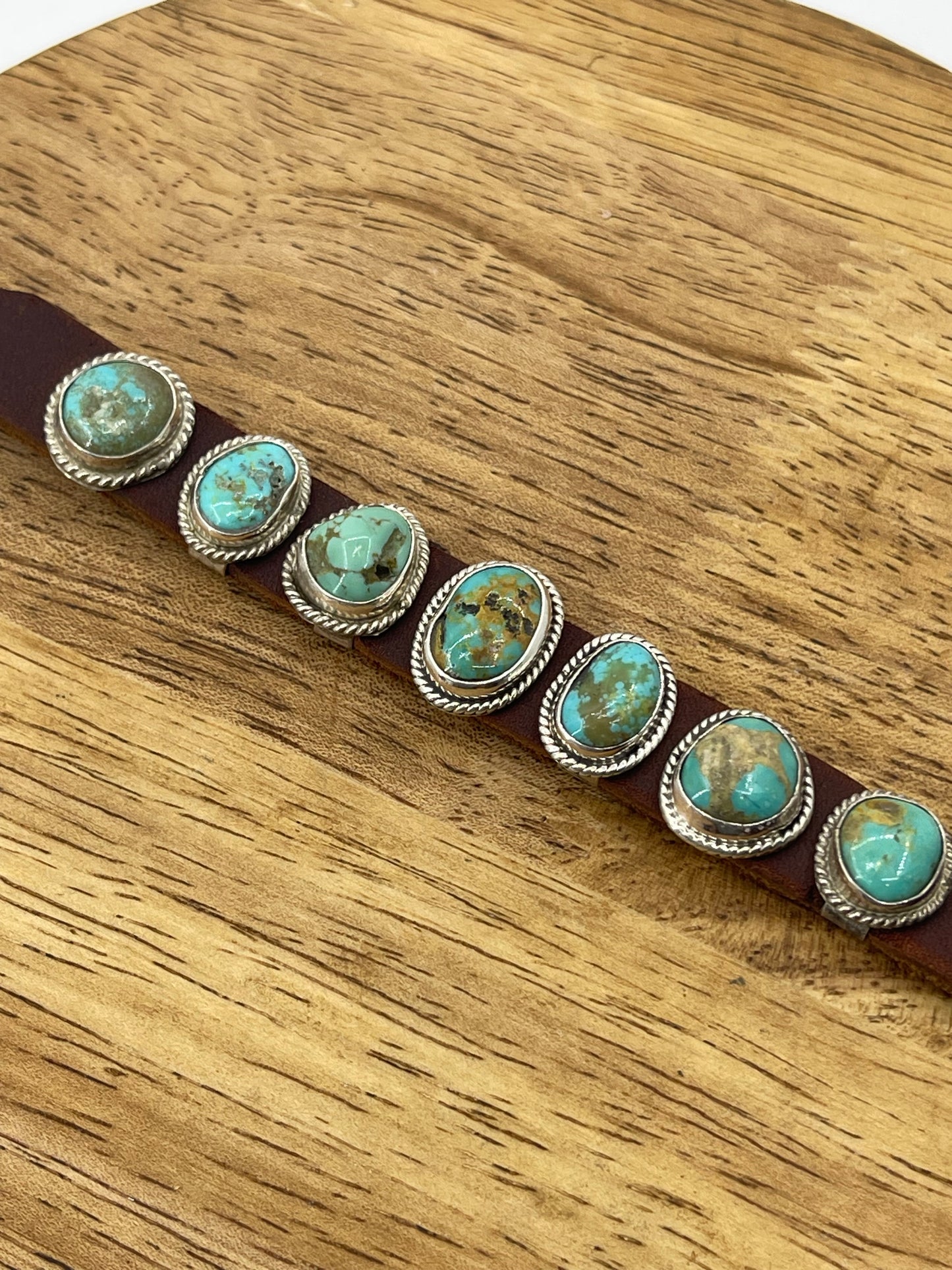 7 Stone Turquoise Leather Cuff by Marie Thompson, Navajo