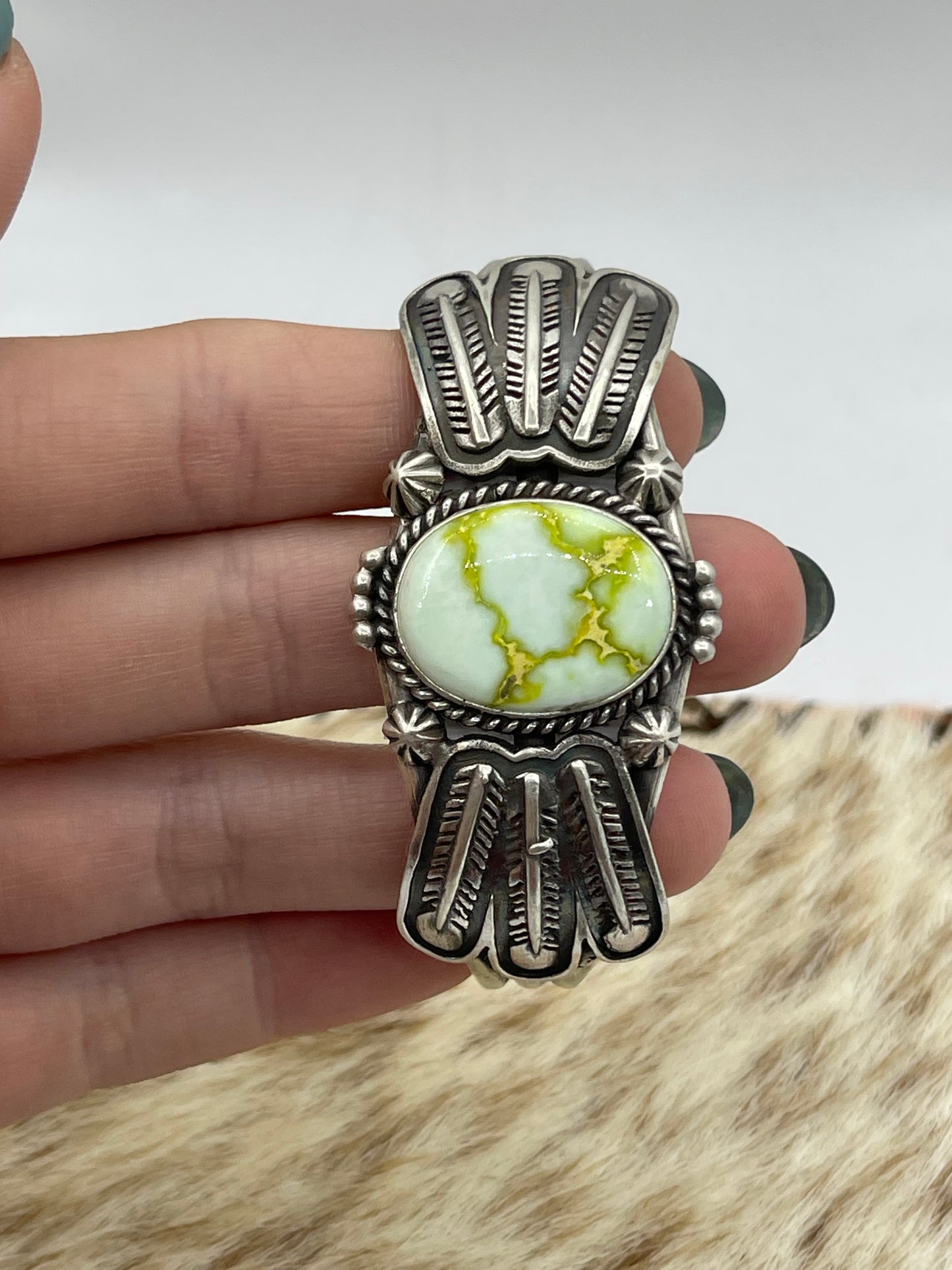 5 3/4"-7 3/4" Palomino Cuff with Feather by Daniel Benally, Navajo (Matrix Varies)