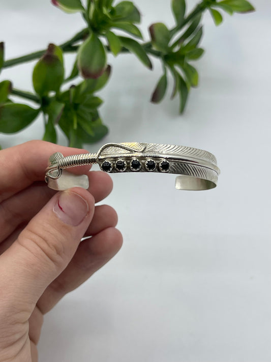 5.5" - 7" 5 Stone Black Onyx Feather Cuff by Aaron Davis, Navajo