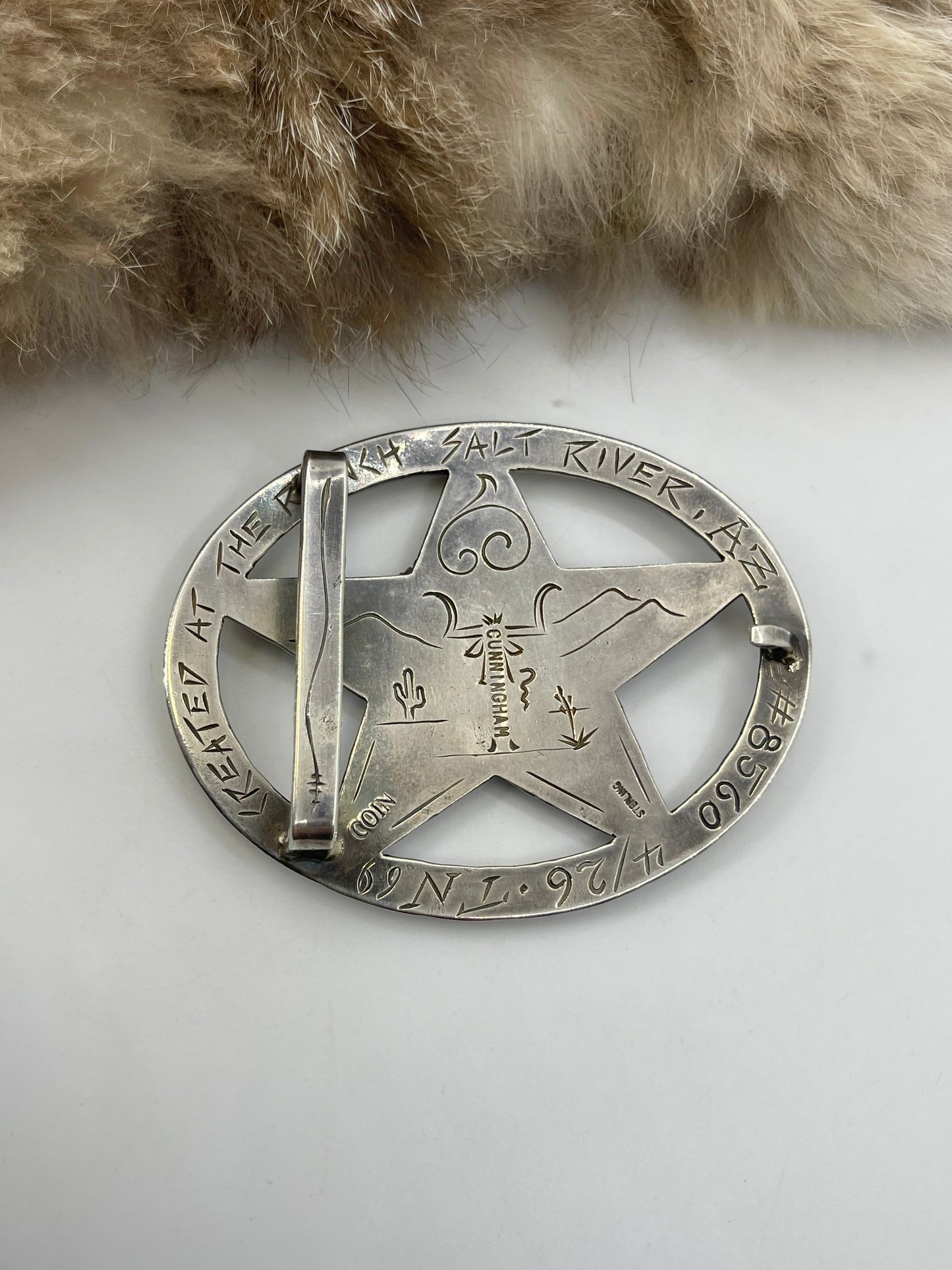 Hand Engraved Star Buckle with Silver Dollar Coin Buckin’ Bronc by Bad Bronc