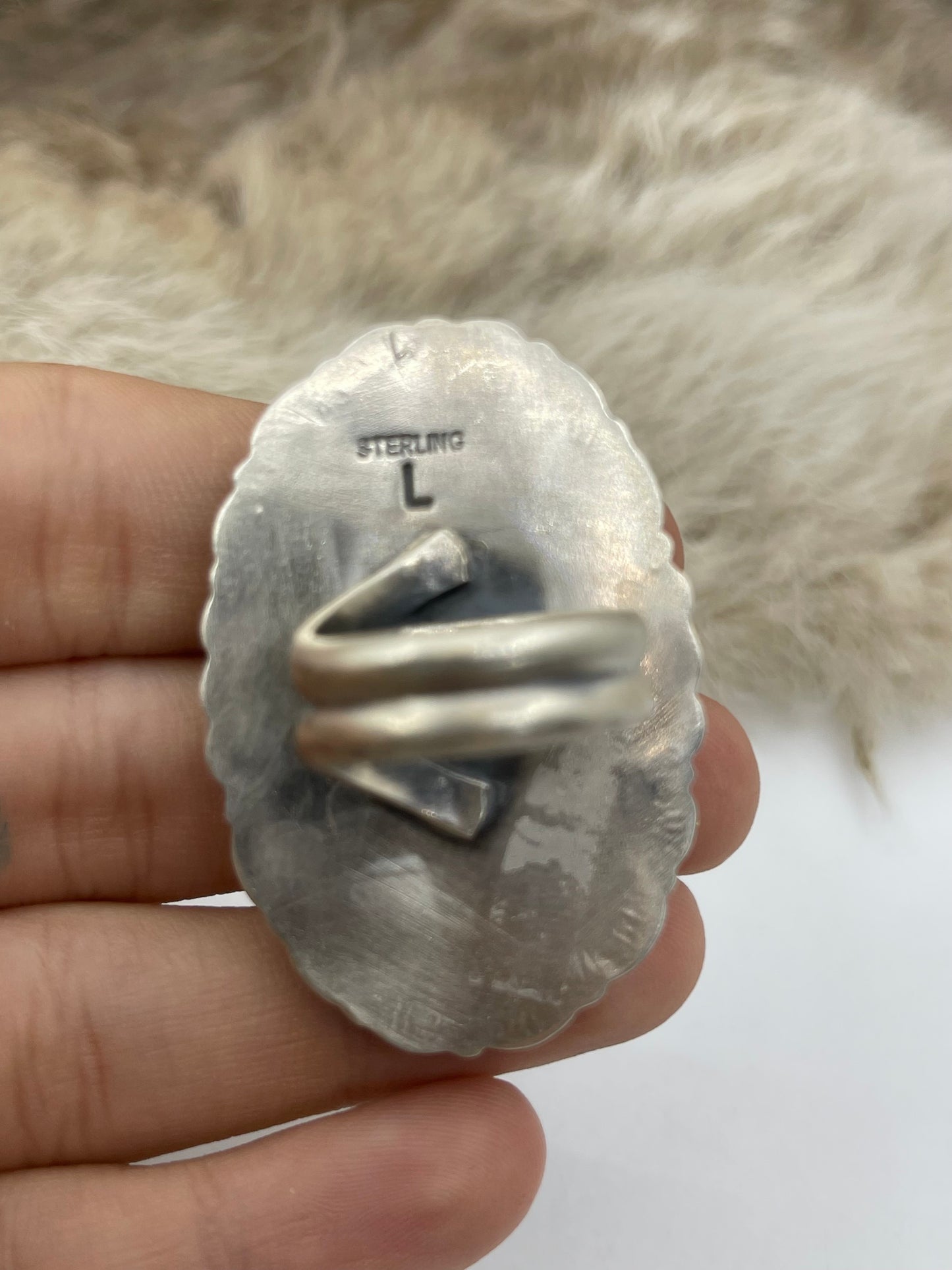 Adjustable 7.0-10.0 White Buffalo Ring with Stamped "L" by Artist