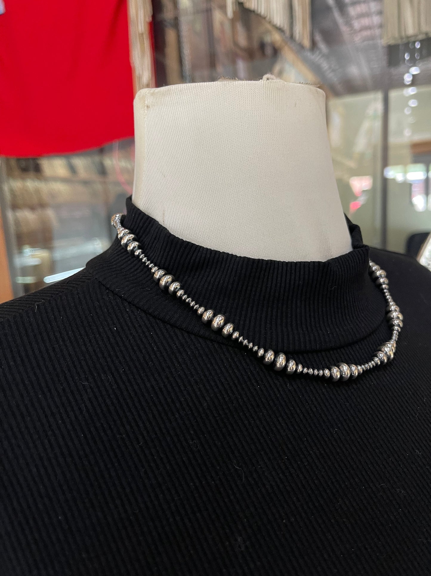18" Varied Size Rondelle Navajo Style Pearl Necklace