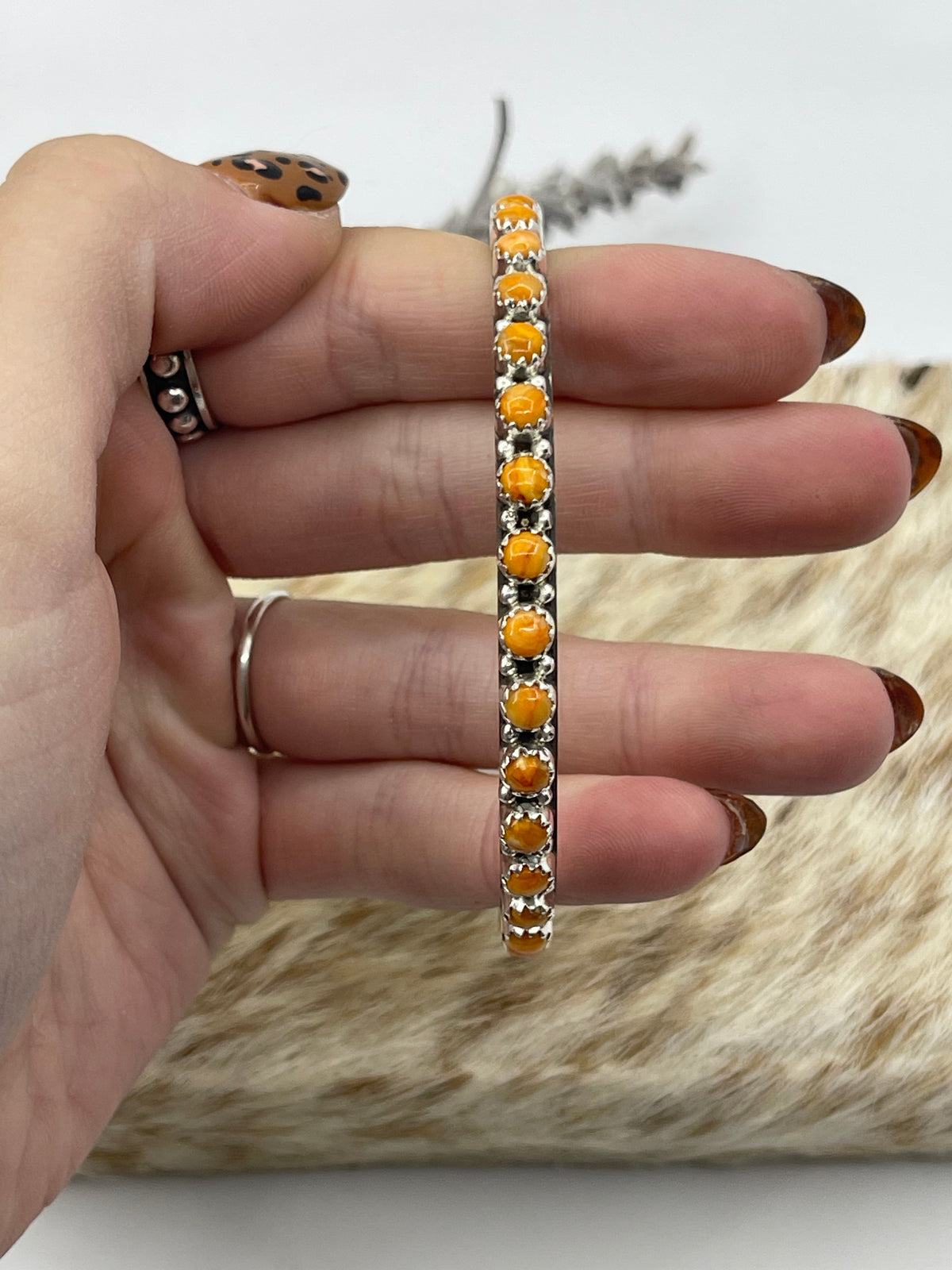 LOT 23 A 10/25 7 3/4" Orange Spiny Oyster Shell Bangle by Gaynell Parker, Navajo