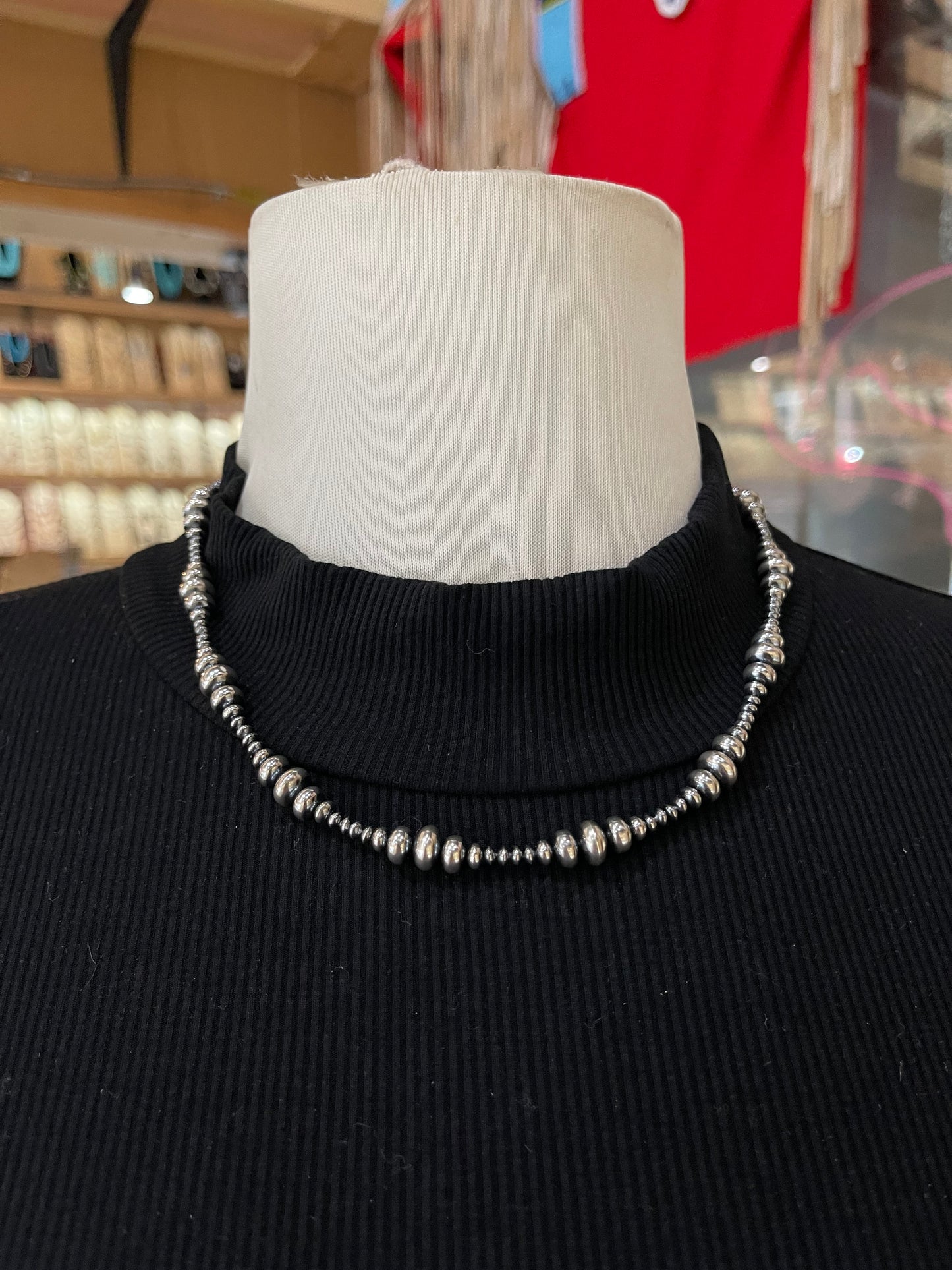 18" Varied Size Rondelle Navajo Style Pearl Necklace