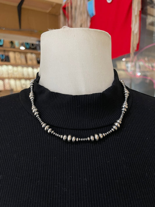 18" Varied Size Rondelle Navajo Style Pearl Necklace