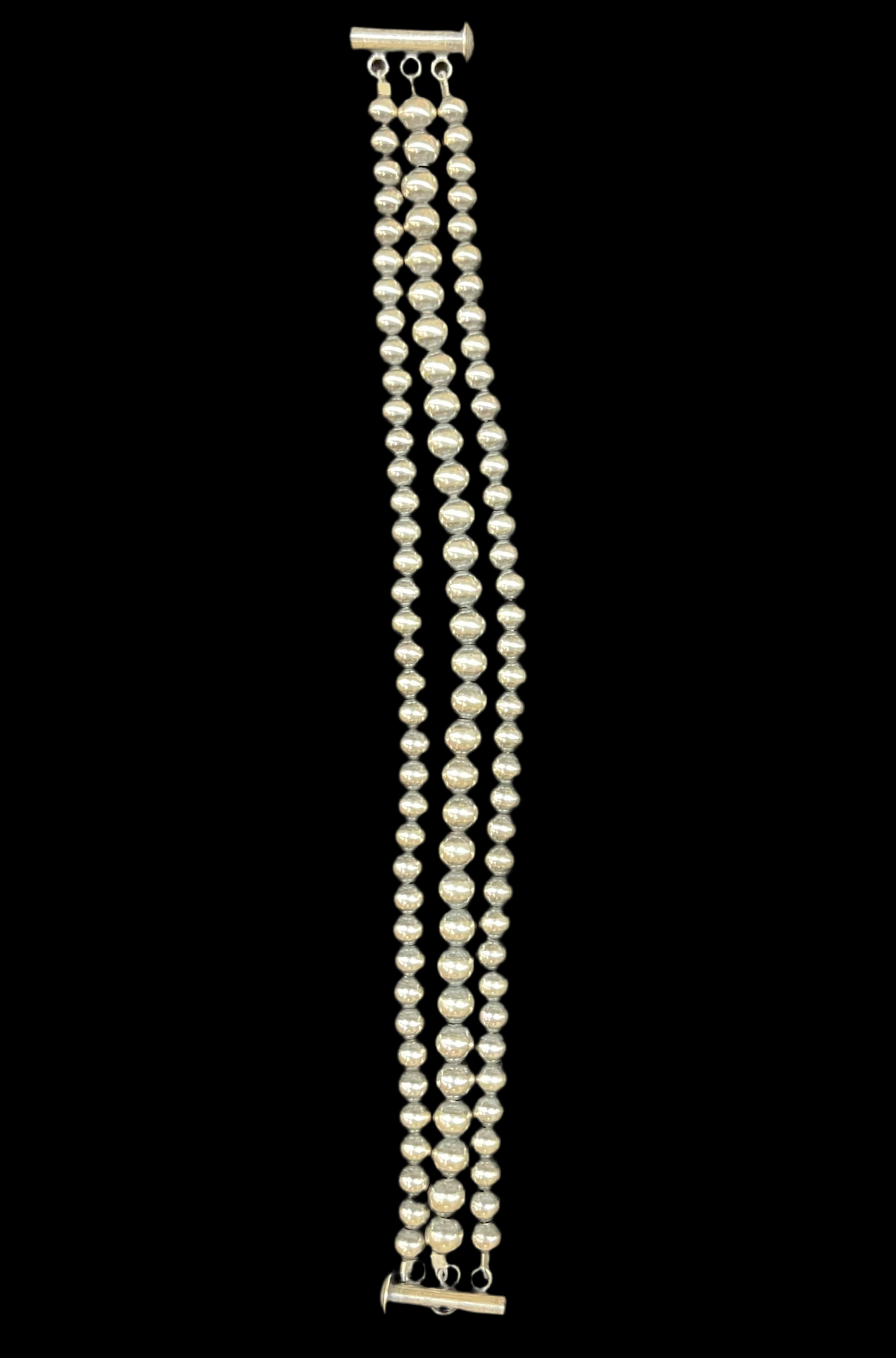 6 3/4" 3 Strand 4mm, and 5mm Navajo Pearl Bracelet