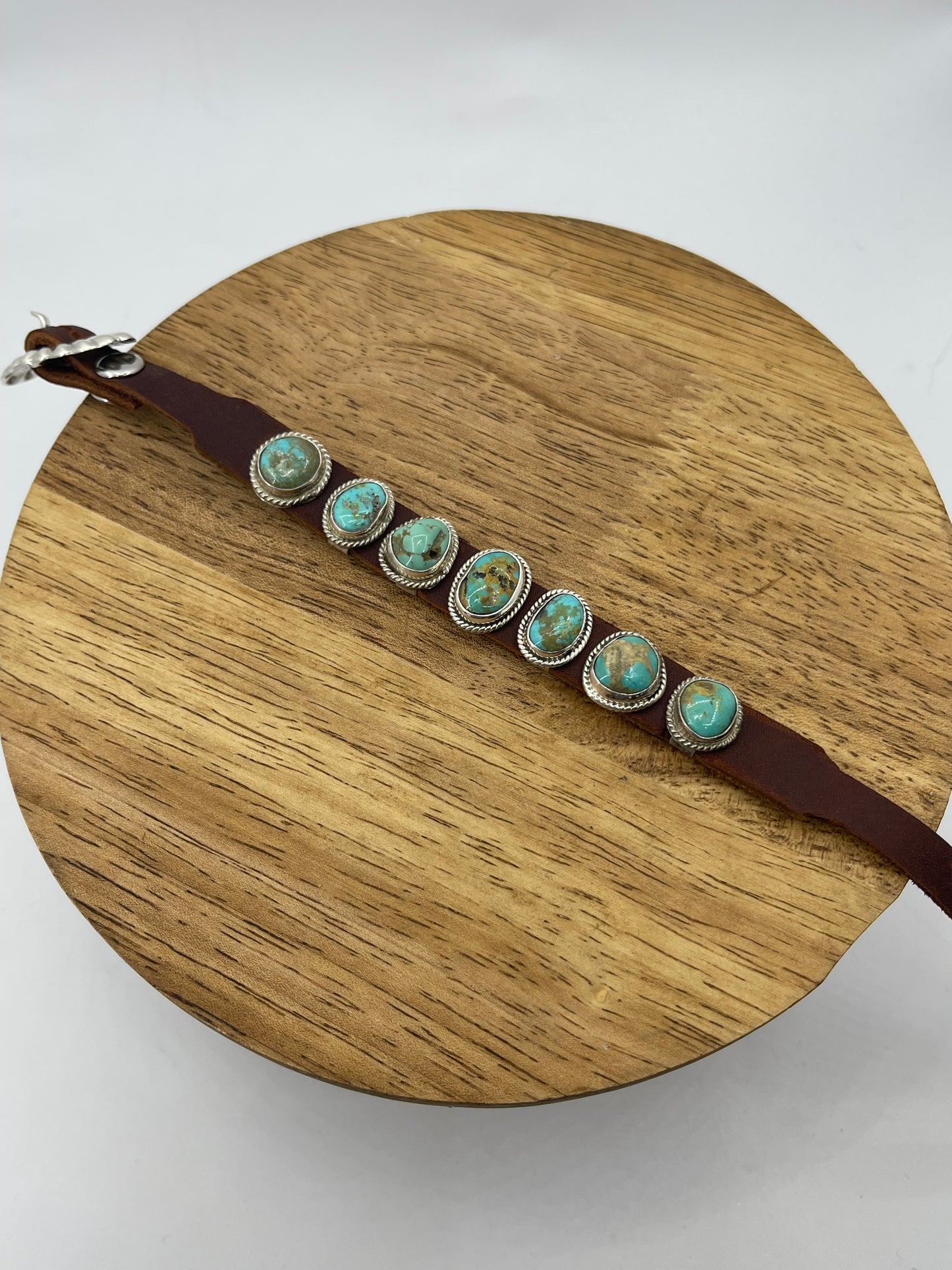 7 Stone Turquoise Leather Cuff by Marie Thompson, Navajo