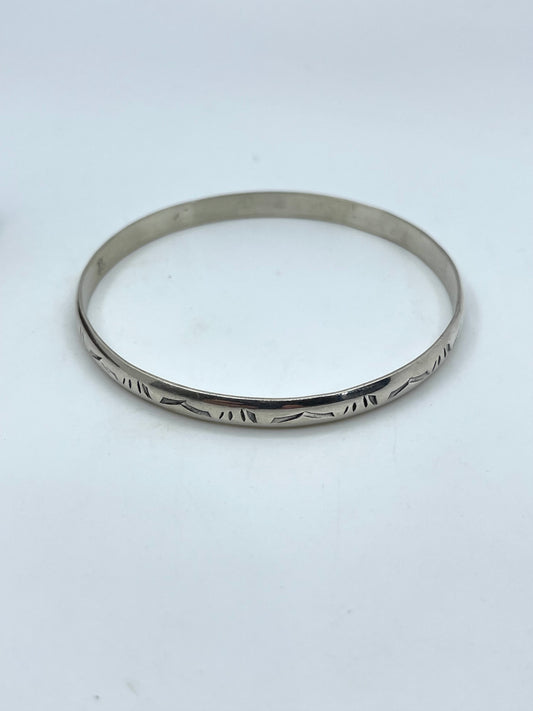 8.25” Stamped Wire Bangle by Elaine Tahe, Navajo