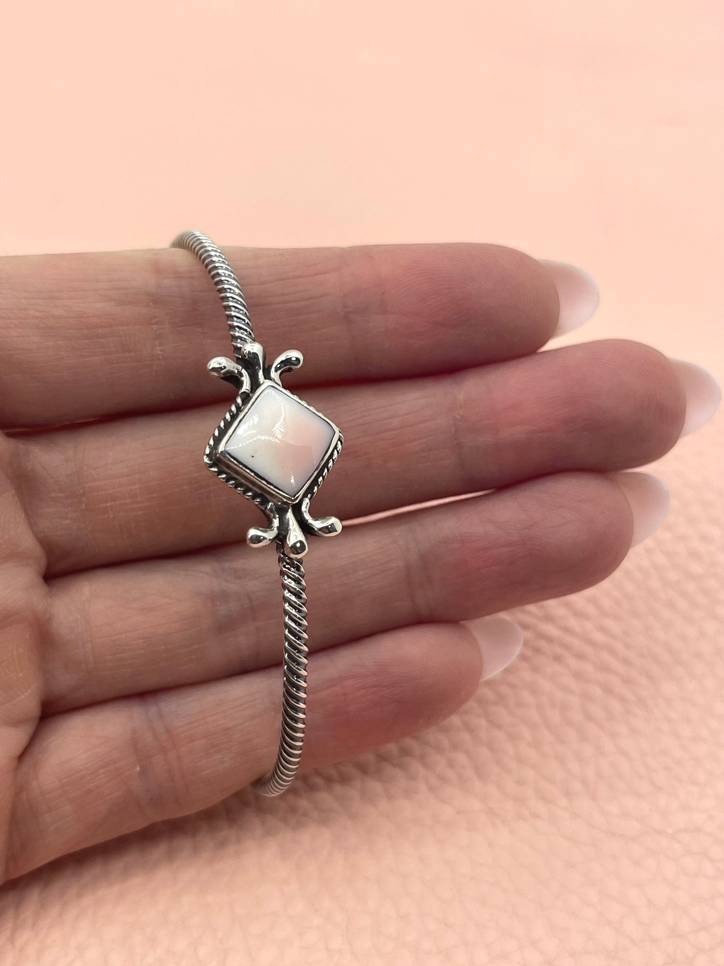 Pink Conch Twisted Wire Cuff by Mike Smith, Navajo