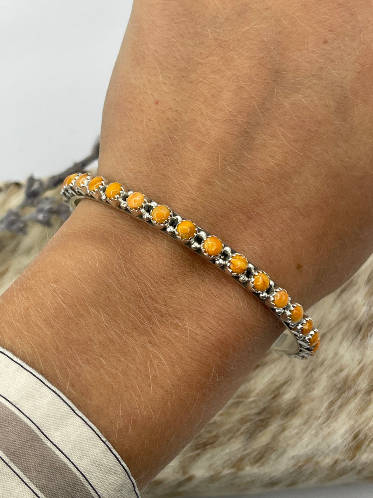 LOT 23 A 10/25 7 3/4" Orange Spiny Oyster Shell Bangle by Gaynell Parker, Navajo