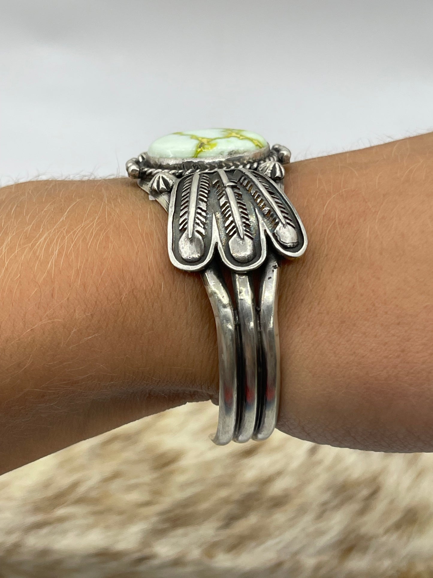 5 3/4"-7 3/4" Palomino Cuff with Feather by Daniel Benally, Navajo (Matrix Varies)