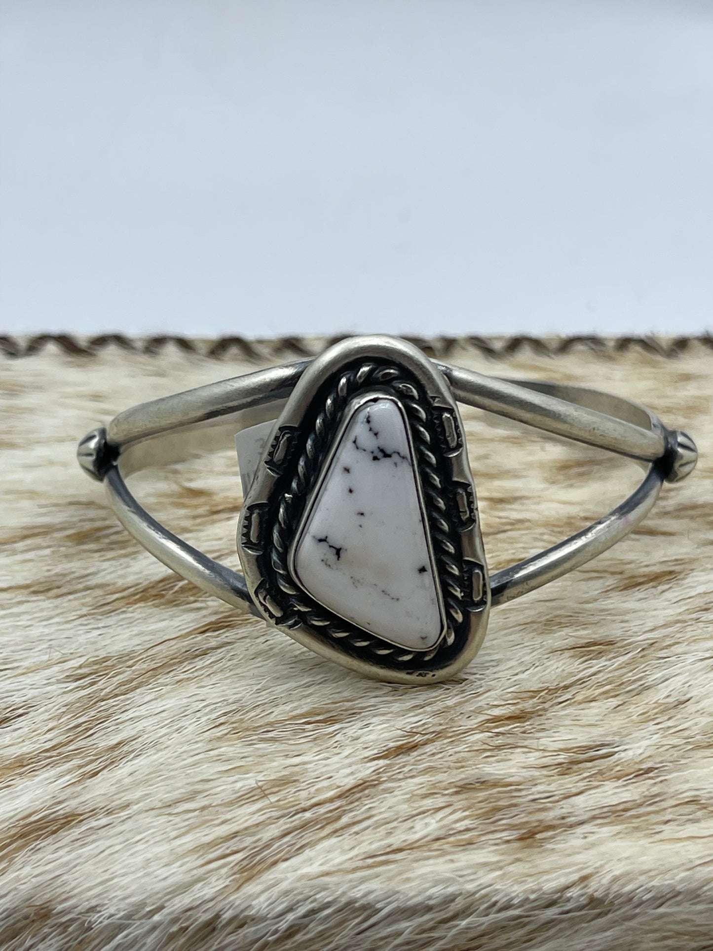 5 1/2"-7 1/2" White Buffalo Triangle Cuff by Johnny Dixon, Navajo