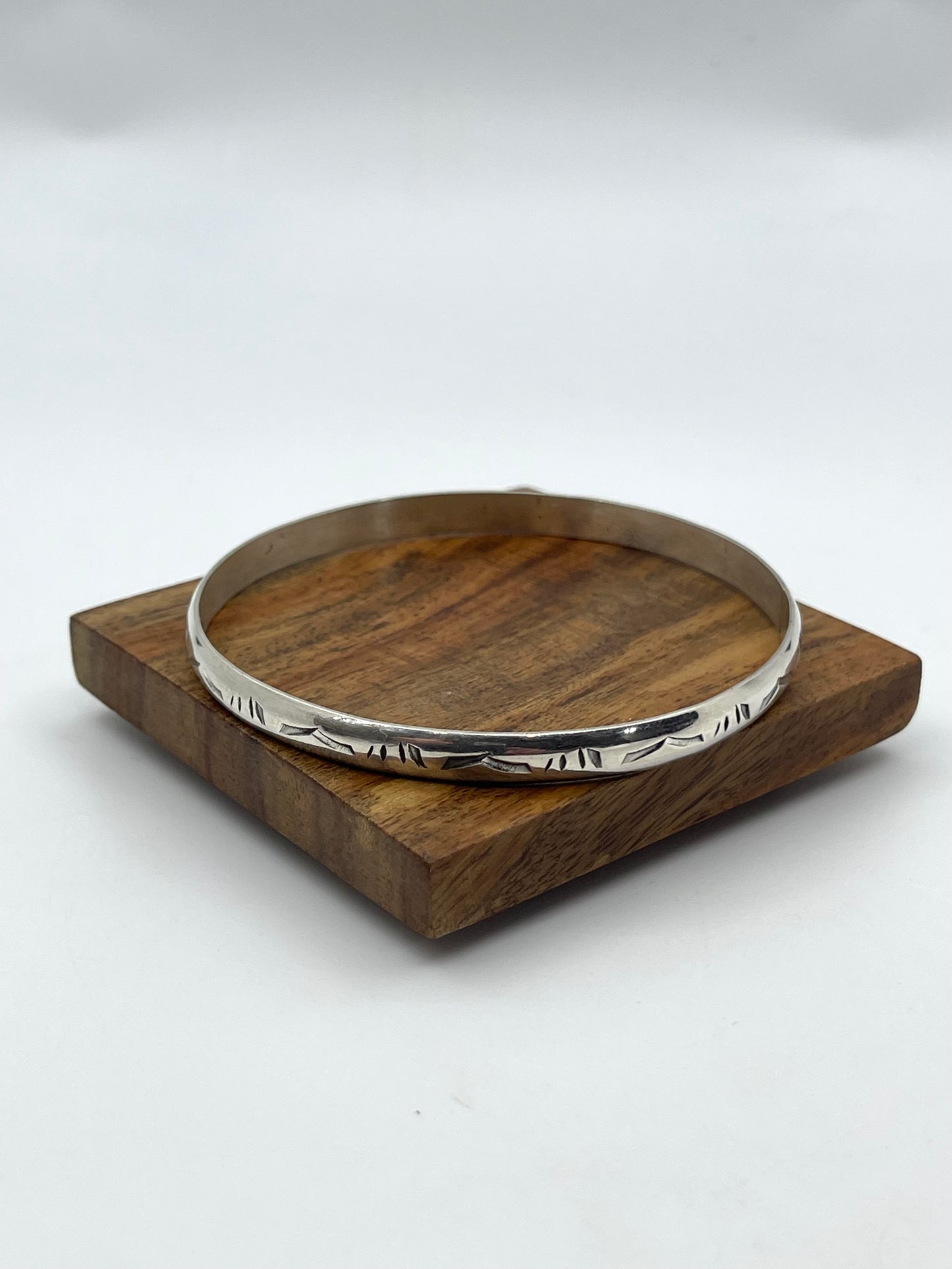 8.25” Stamped Wire Bangle by Elaine Tahe, Navajo