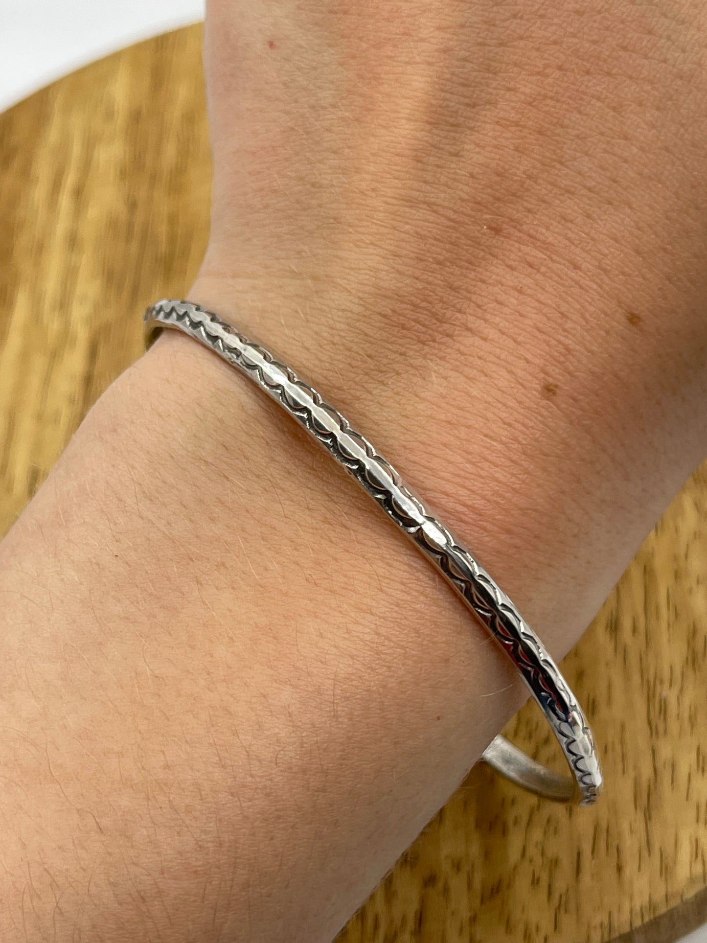 8" Stamped Triangle Wire Bangle by Elaine Tahe, Navajo