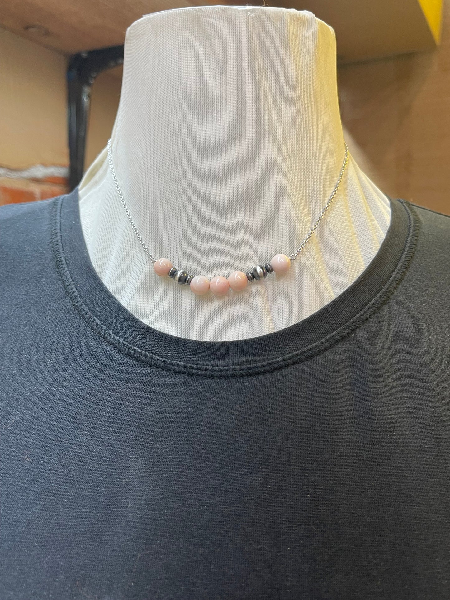 Pink Conch and Navajo Pearls