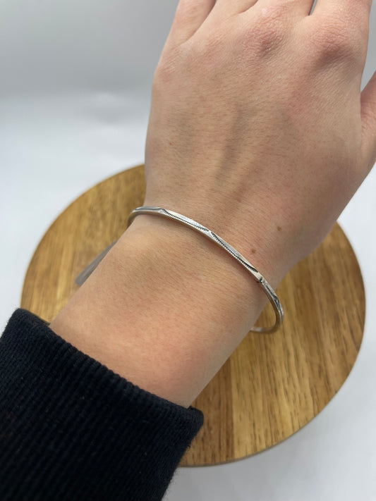 8" Sterling Silver Stamped Bangle by Elaine Tahe, Navajo