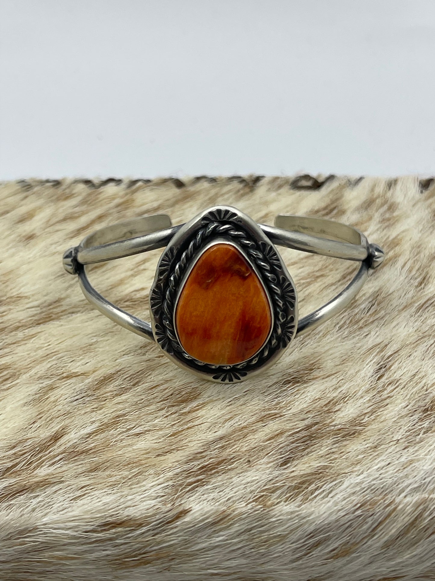 7 3/4"-7 1/4" Teardrop Orange Spiny Oyster Shell Cuff by Augustine Largo, Navajo