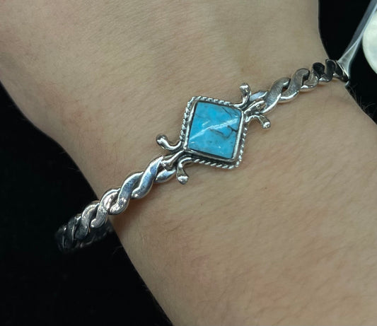 6"-7 1/4" Turquoise Diamond Shaped Twisted Cuff by Mike Smith, Navajo