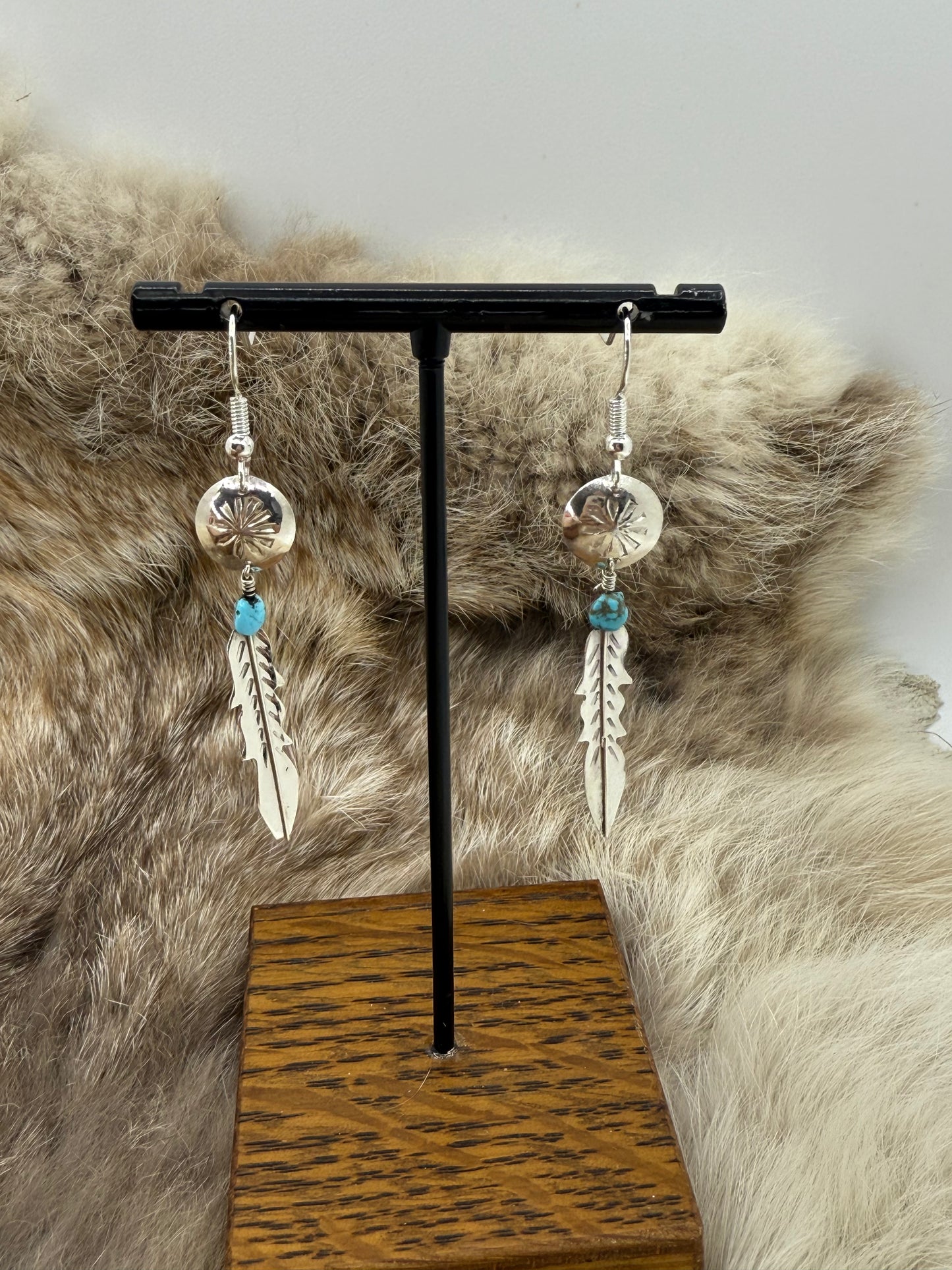 Stamped Concho with Feather Dangle Earrings by Vernon Tsosie, Navajo