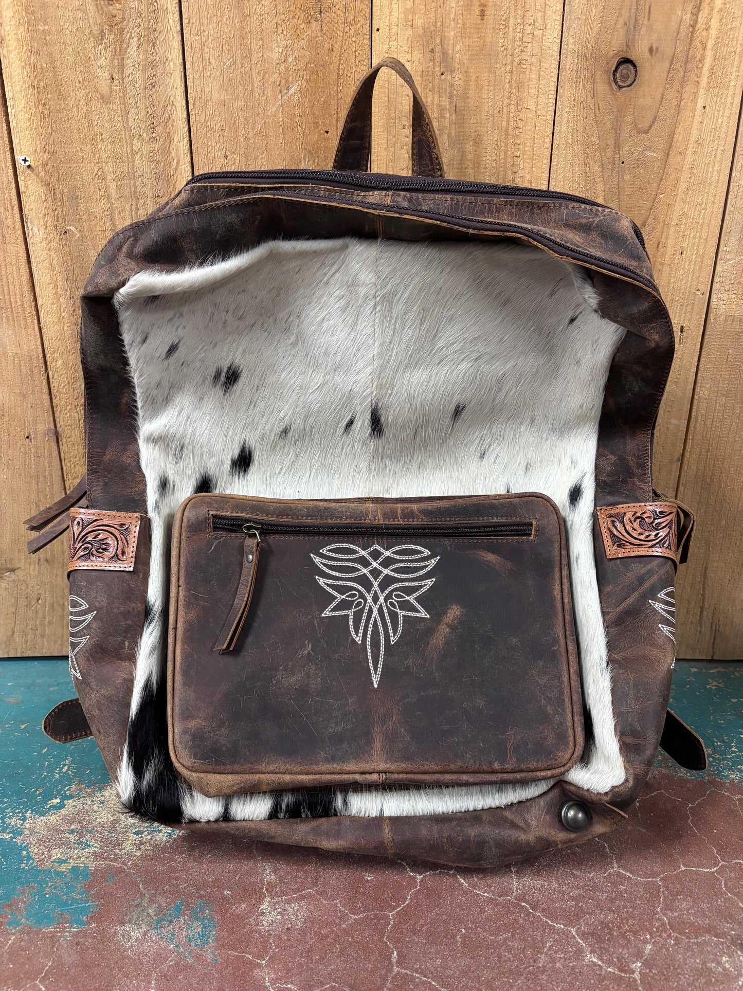 White And Black Cowhide Boot Stitched Leather Backpack