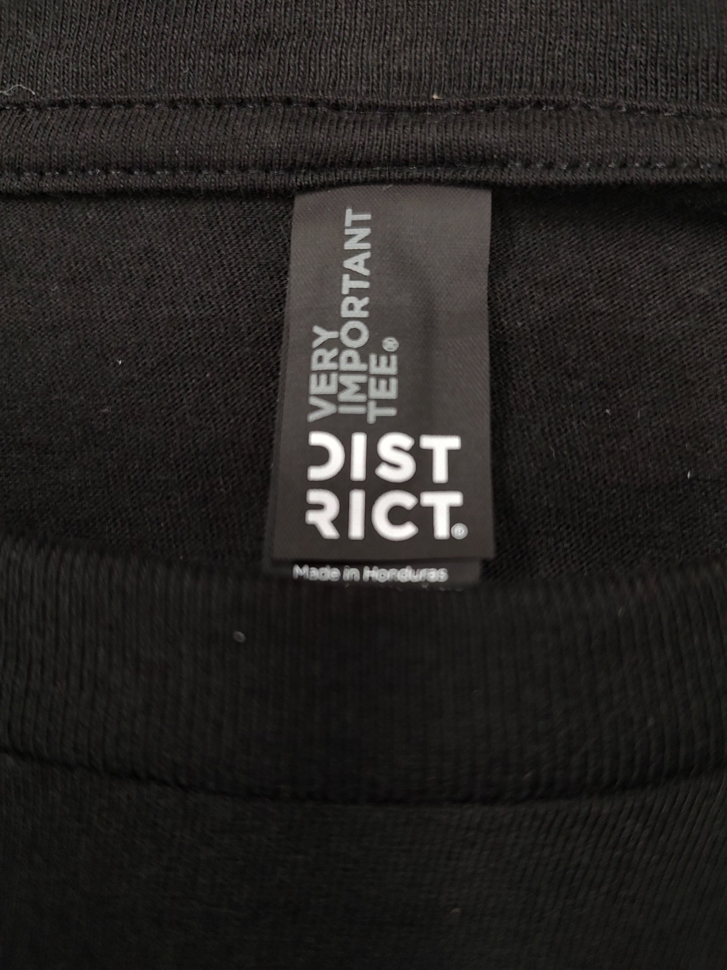 Orange Buckin' Flamingo Logo on a Black Shirt