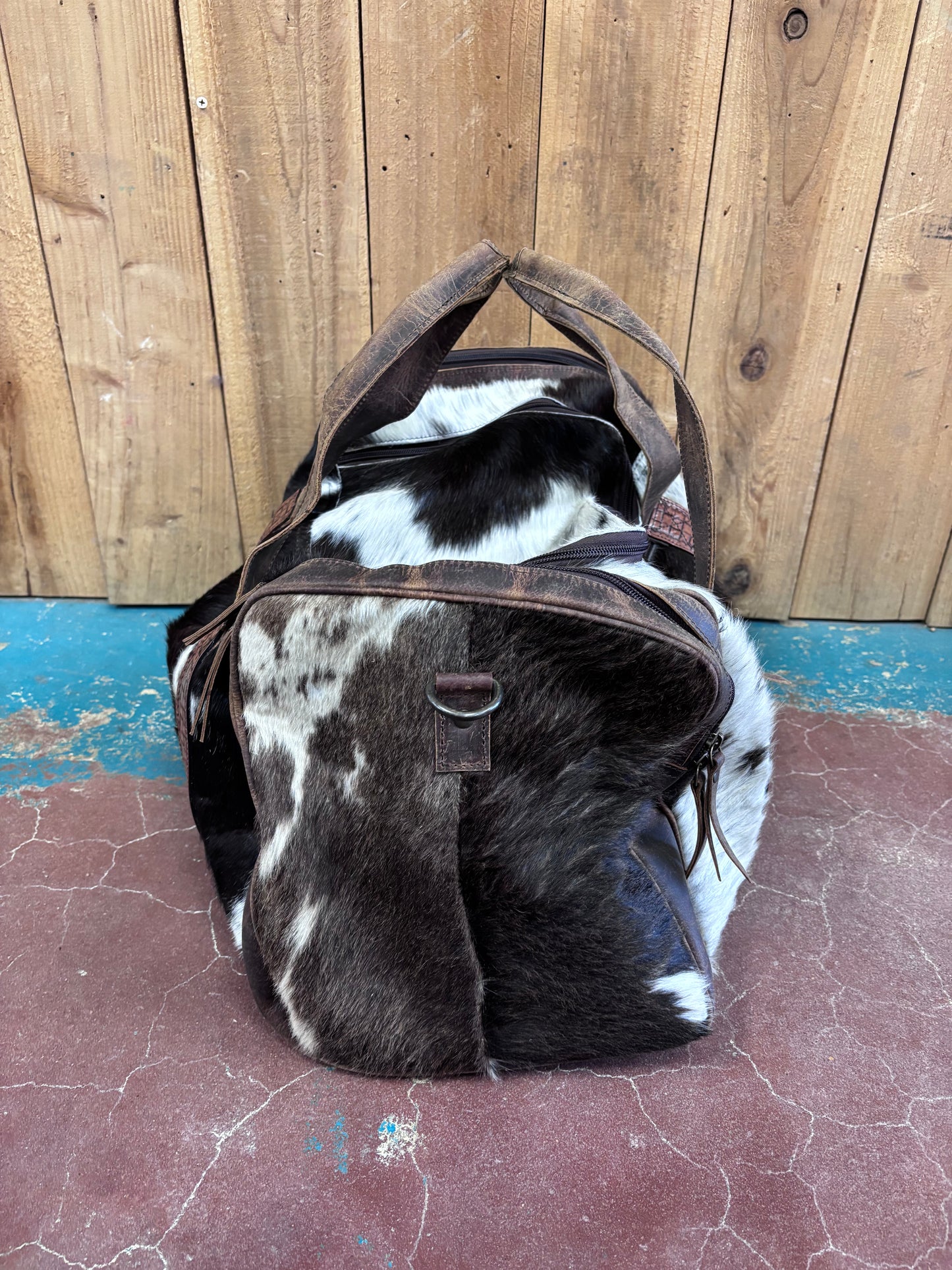 Brown And White Cowhide Duffle Bag