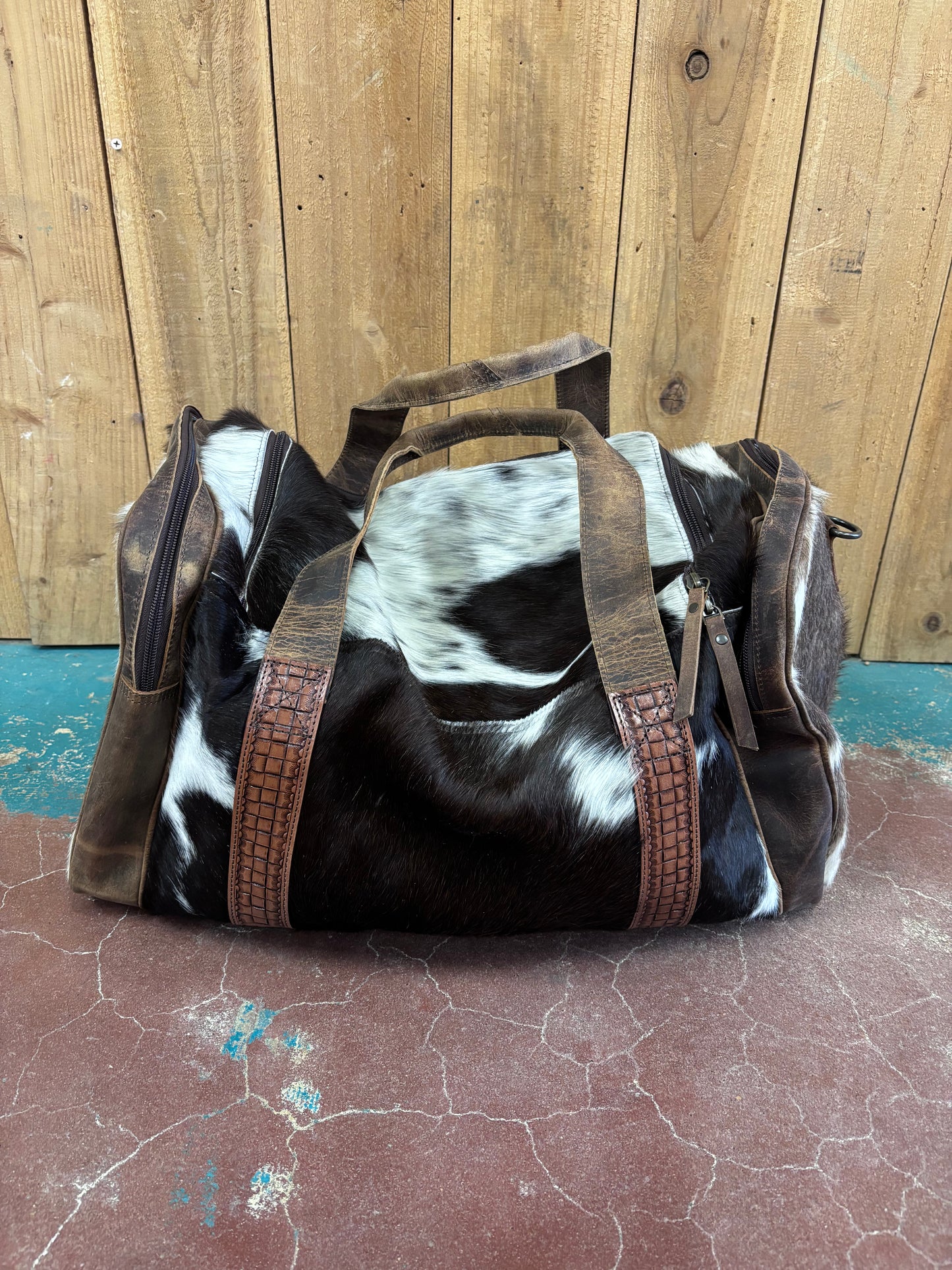 Brown And White Cowhide Duffle Bag