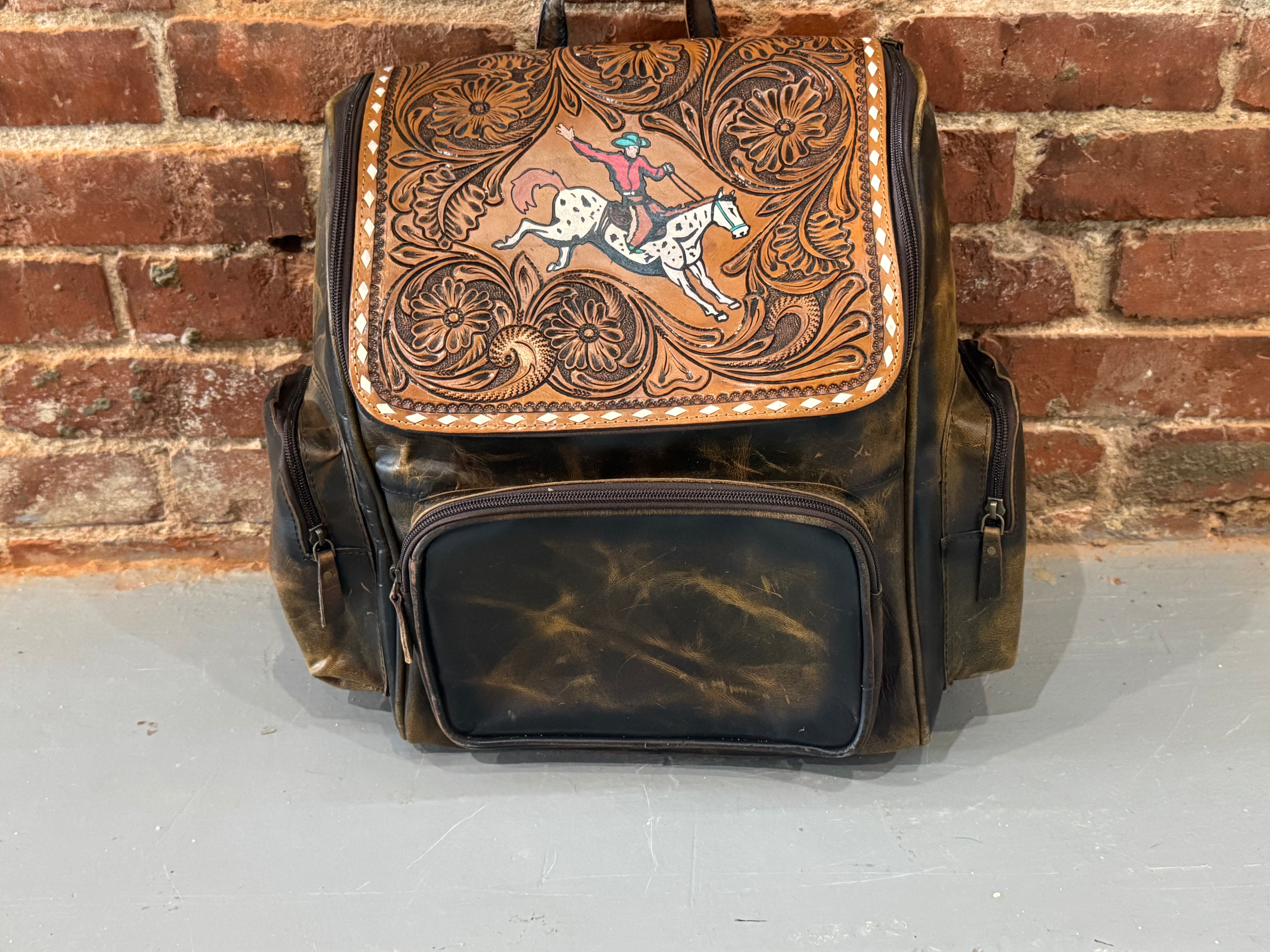 Bull Rider Backpack Handmade leather backpack with cowboy on horse – Buckin' Flamingo