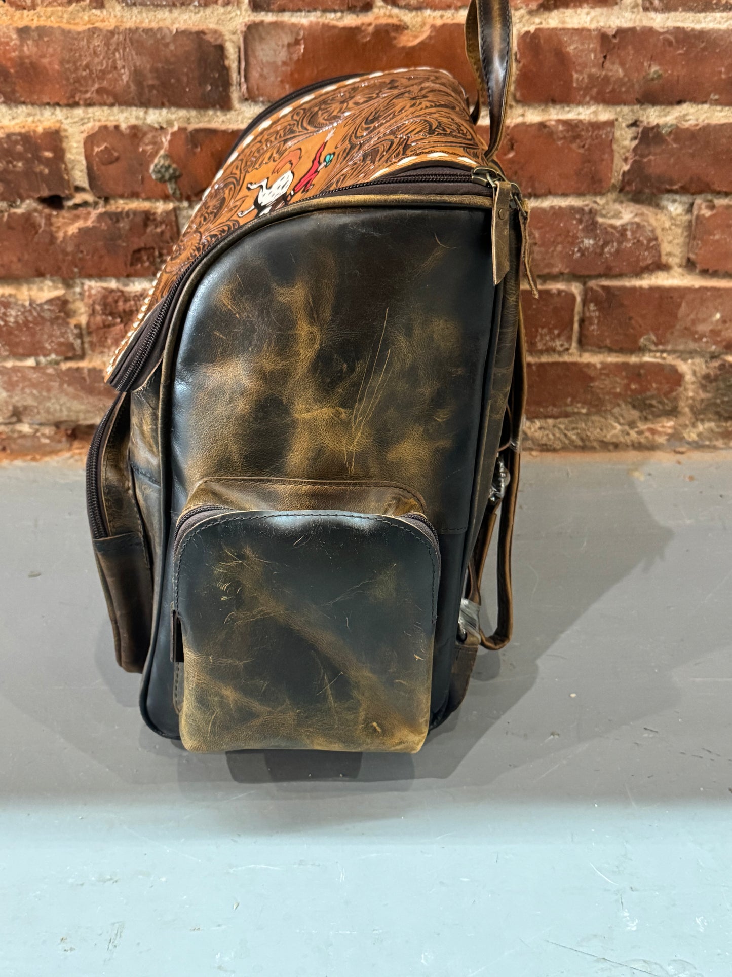 Handmade leather backpack with cowboy on horse