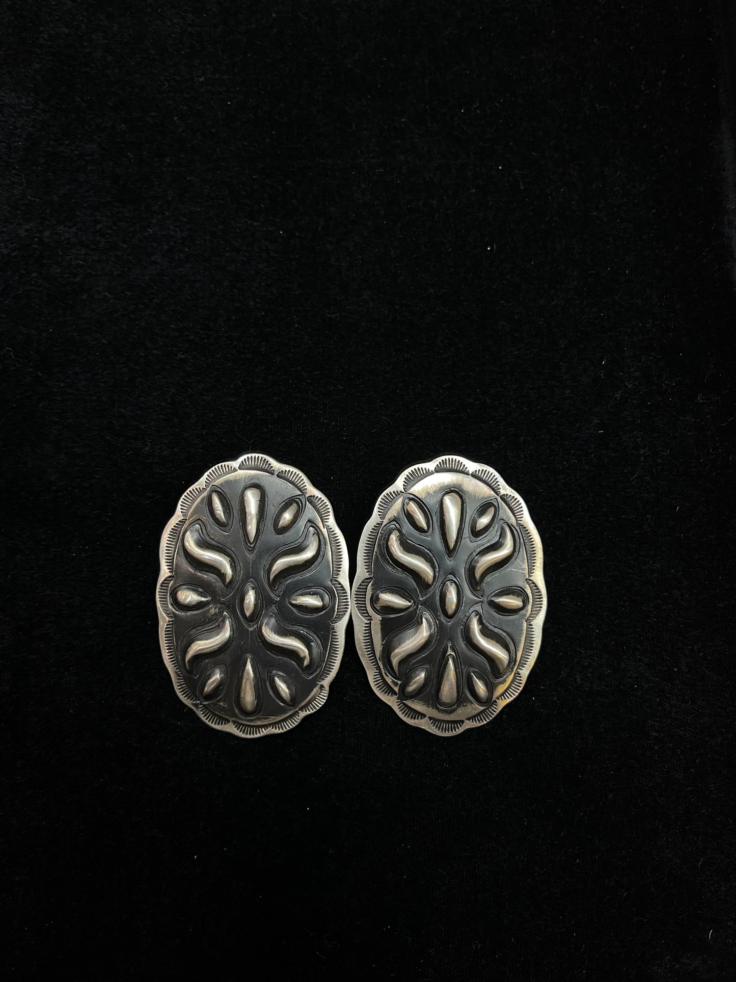 Big Concho Stamped Earrings by Leander Tahe, Navajo