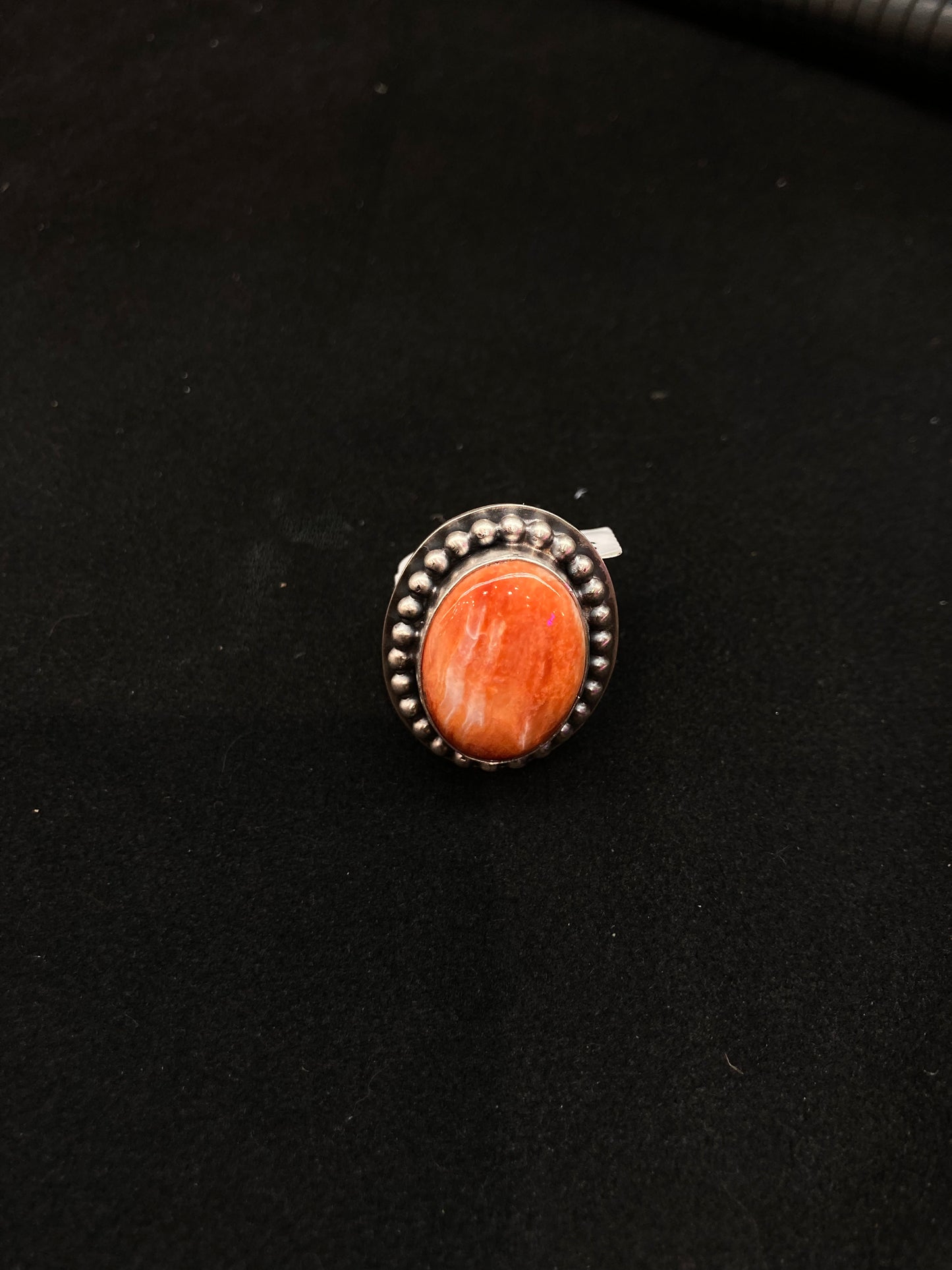 7.0 Orange Spiny Oyster Shell Ring by Calvin Delgarito, Navajo