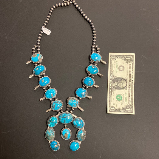Native American made Kingman turquoise squash blossom necklace by Gilbert Nez